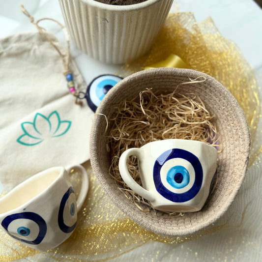 Gift Hamper Combo - 1 Tokri Basket, 2 Evil Eye Coffee Mug, 1 Evil Eye Cow Bell